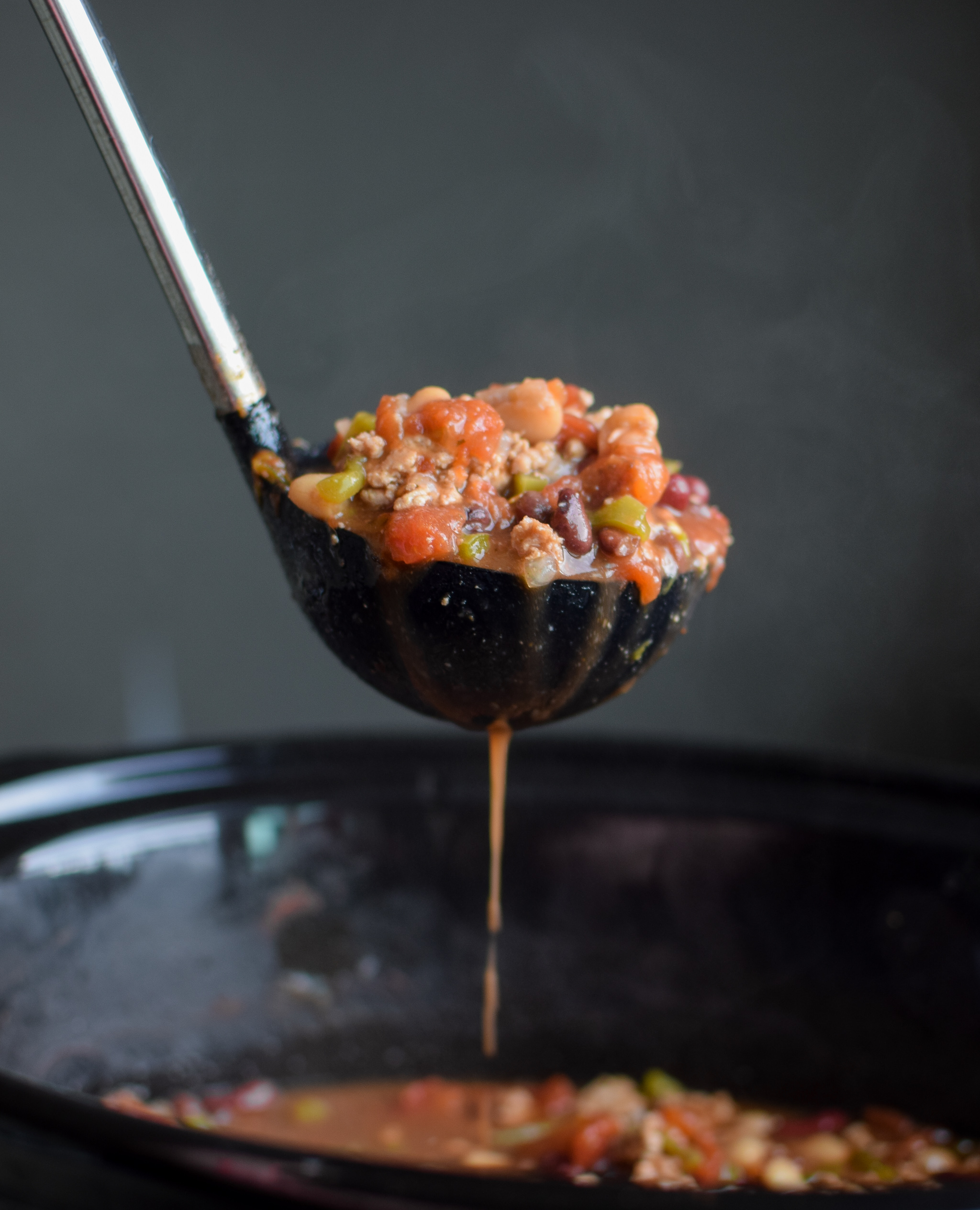 Easy Slow Cooker 4-Bean Turkey Chili recipe - A slow cooker classic that should be in everyone's cookbook! A hearty bean and turkey chili with some smokey kick! - ProjectMealPlan.com