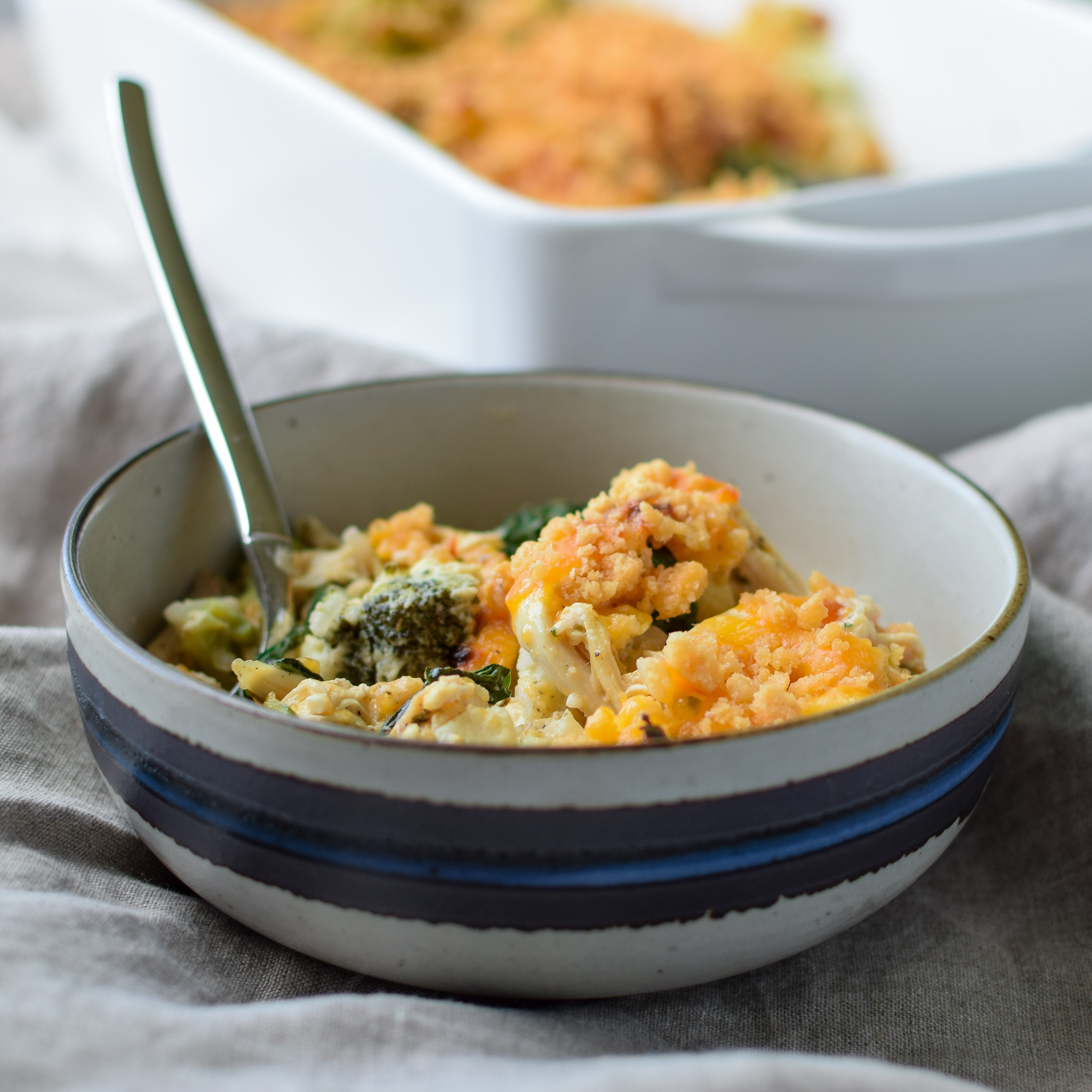 A fresh dished up bowl of Veggie Loaded Rotisserie Chicken Casserole.