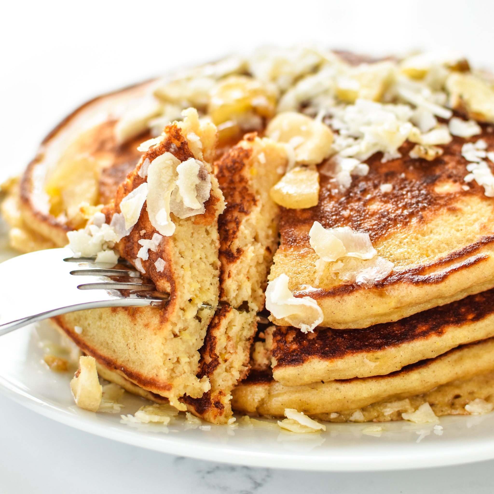 Tropical Pineapple Protein Pancakes Recipe - A perfect blend of pineapple helps keep these delicious protein pancakes moist and perfect for on-the-go! - ProjectMealPlan.com