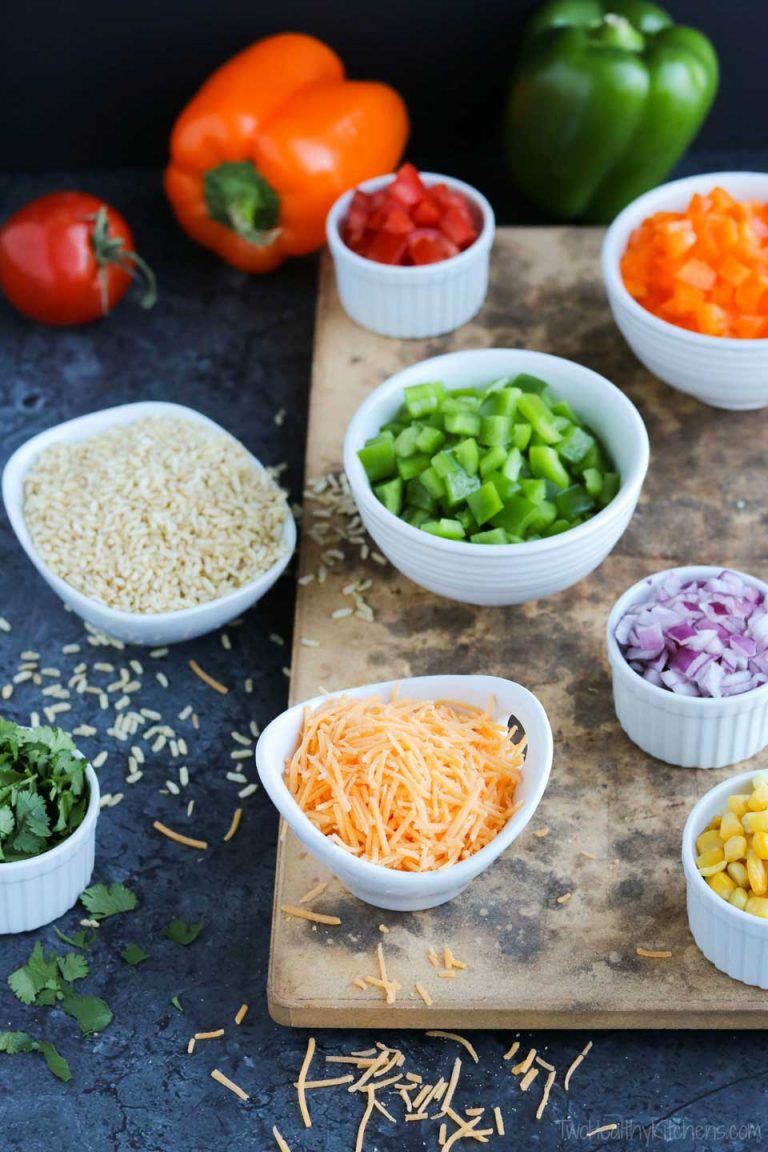 Bowls of prepped ingredients like peppers and onions to demonstrate mis en place.