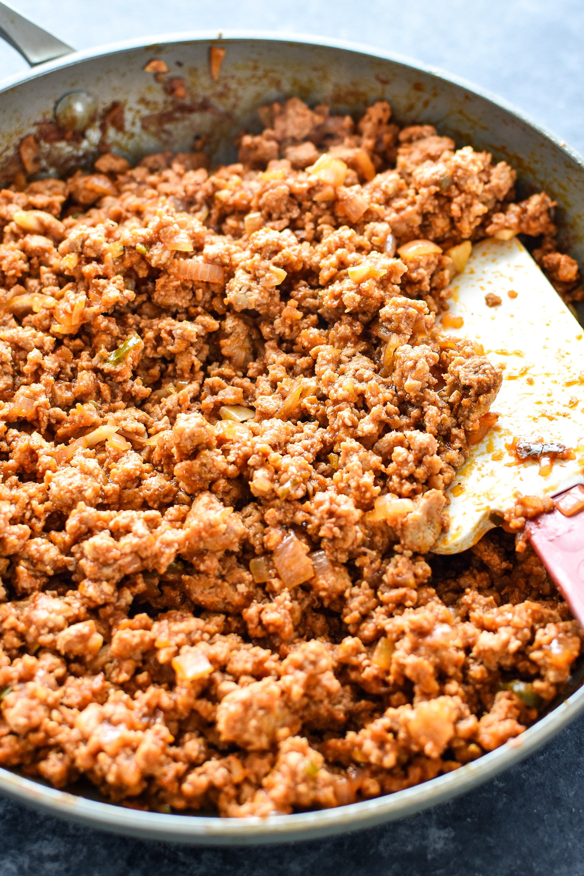 A big skillet full of homemade ground turkey sloppy joes done cooking.