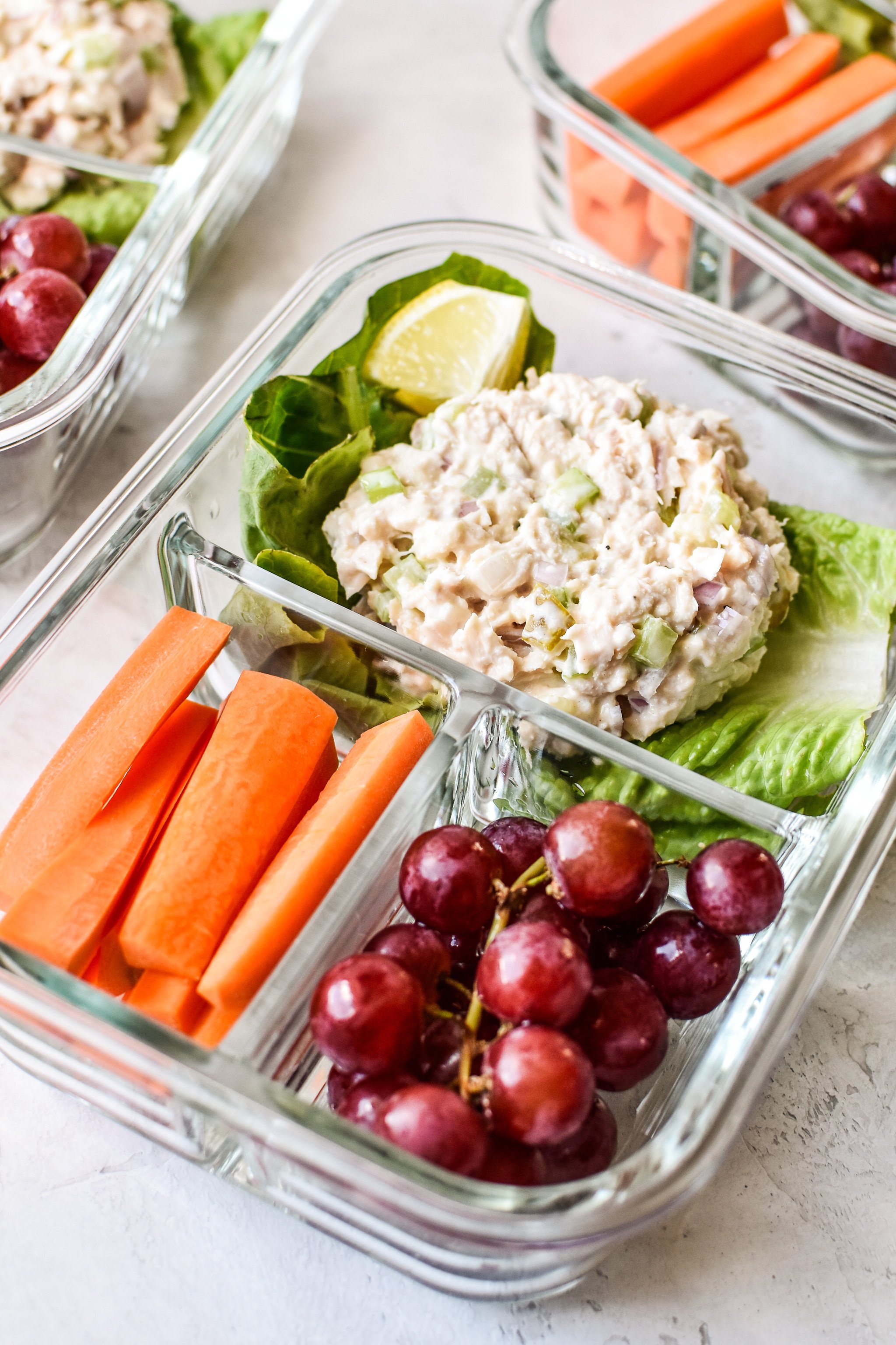 Low carb tuna salad meal prep lunch with carrots and grapes.