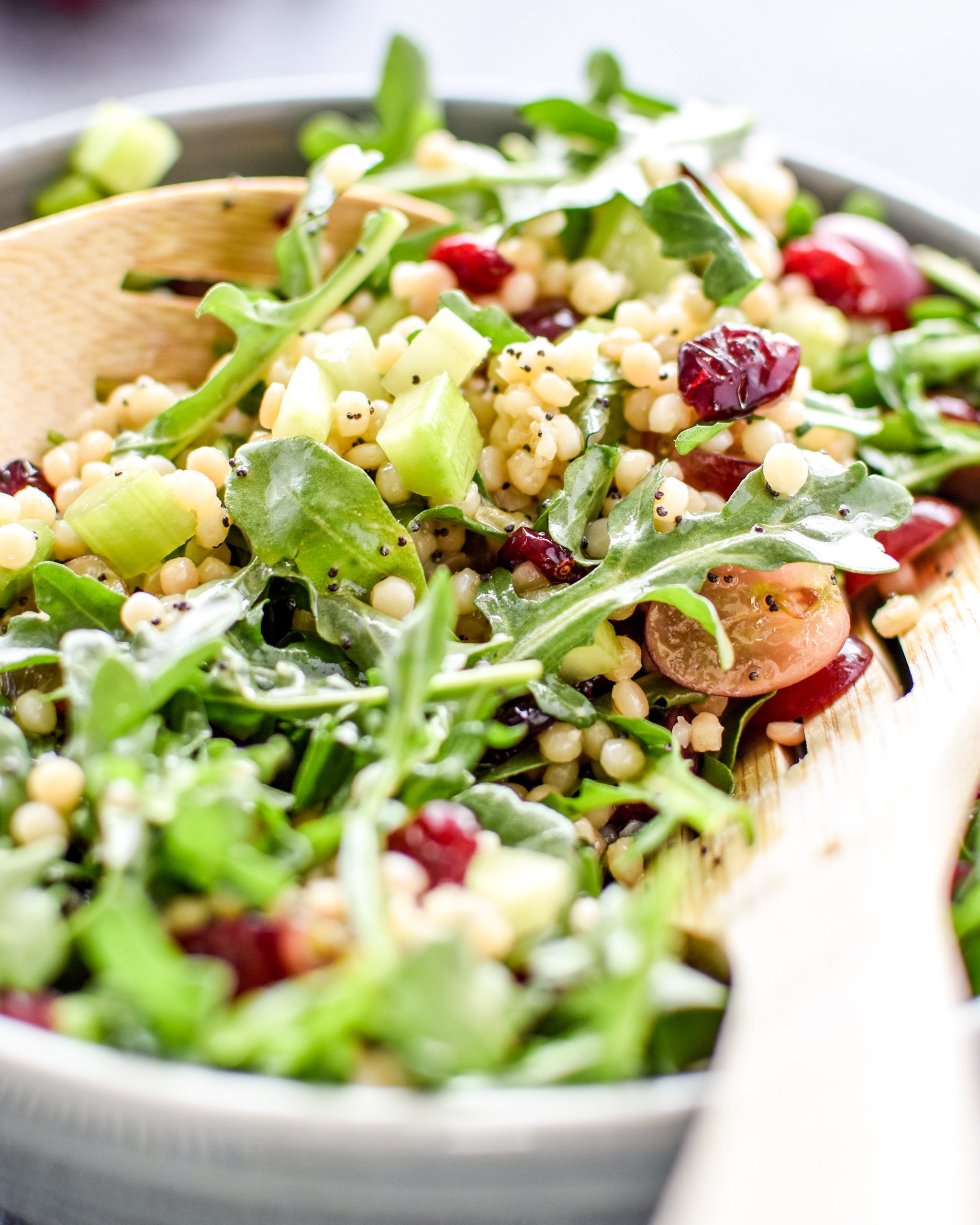 Make ahead lemon poppyseed couscous arugula salad with dressing poured on top.