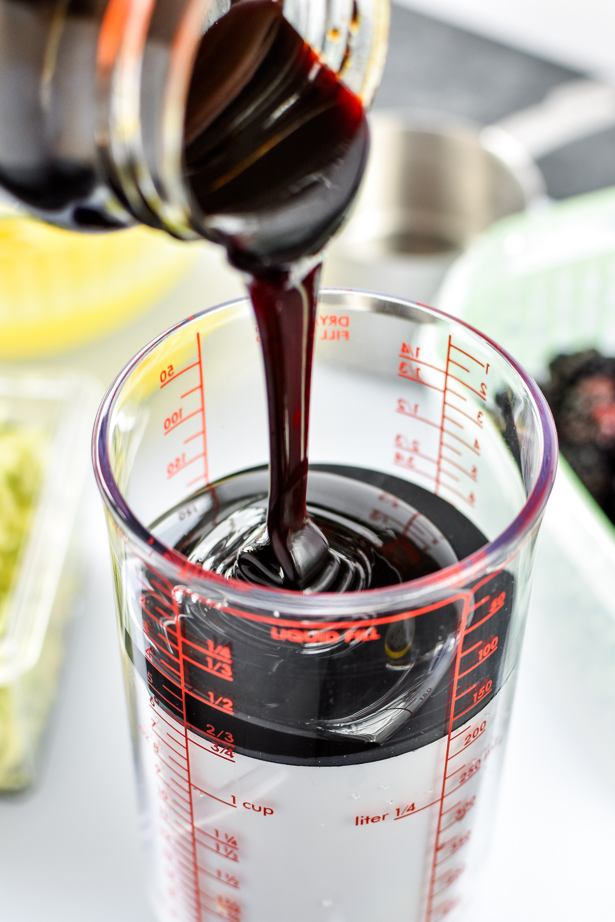 Using an OXO adjustable measuring cup to measure molasses.