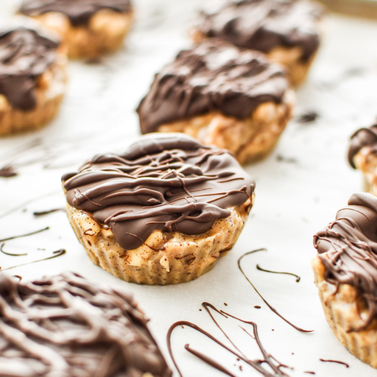 espresso crunch cashew butter cups with chocolate drizzle on top.
