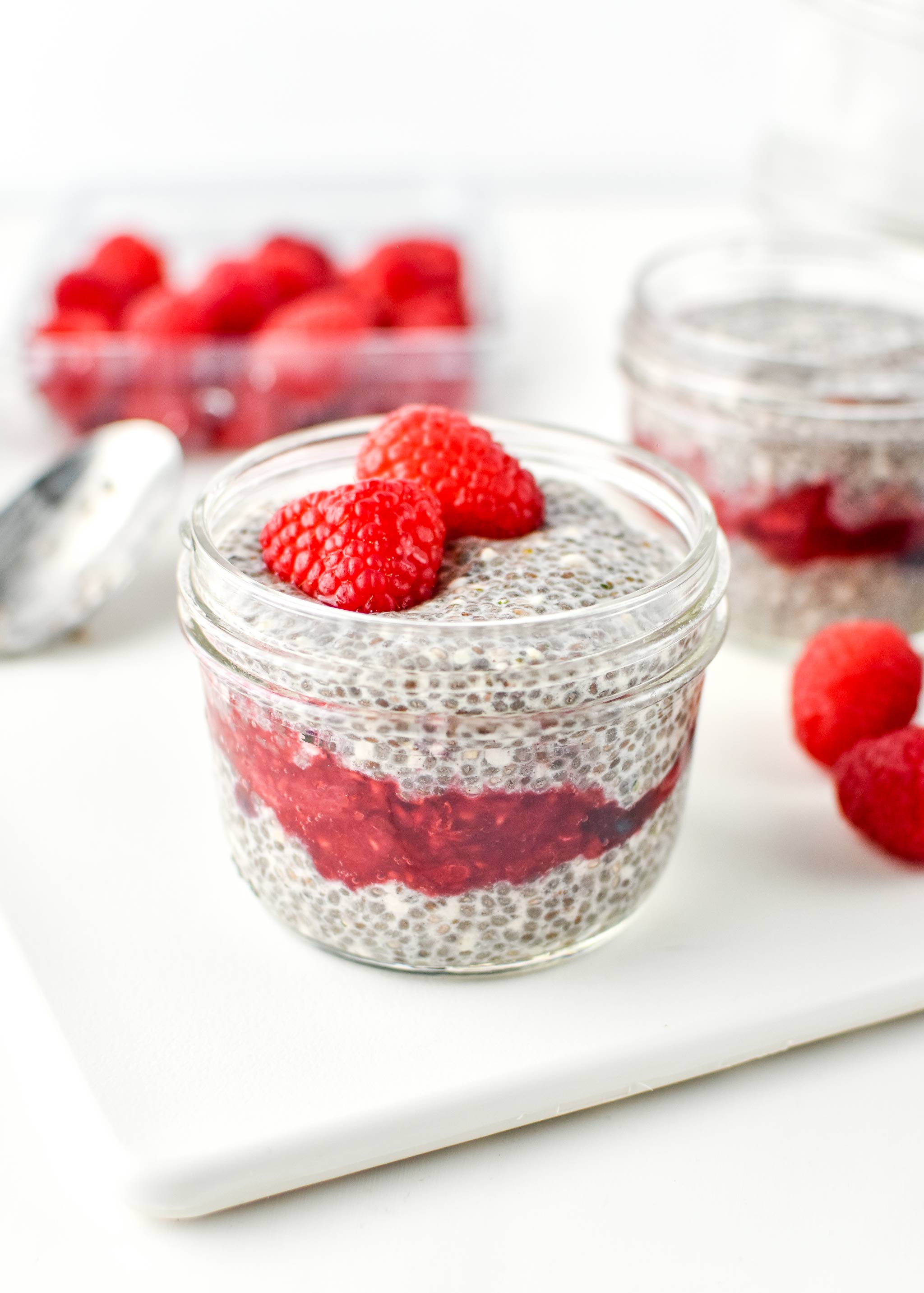 Chia pudding breakfast parfait with raspberries on top