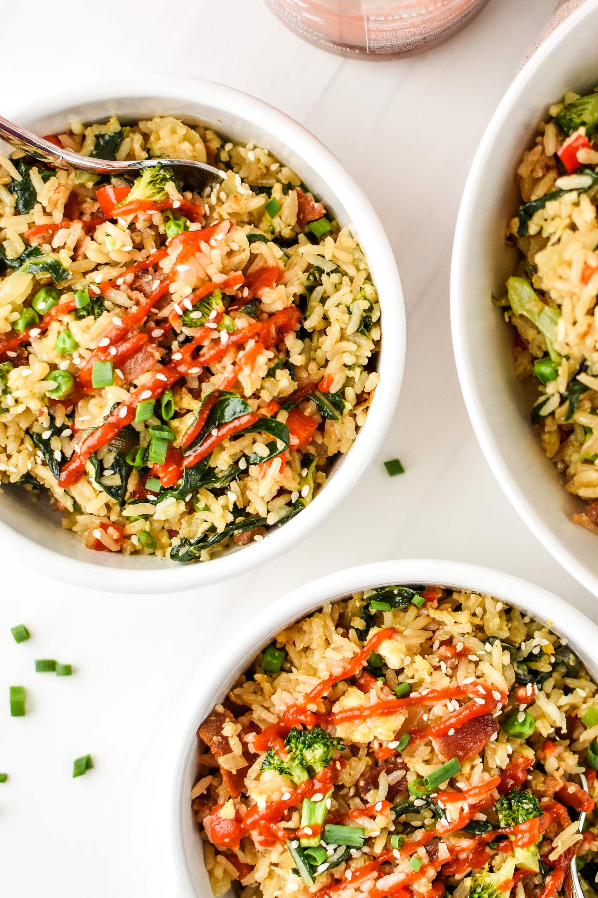 Bowls of veggie packed breakfast fried rice seen from above