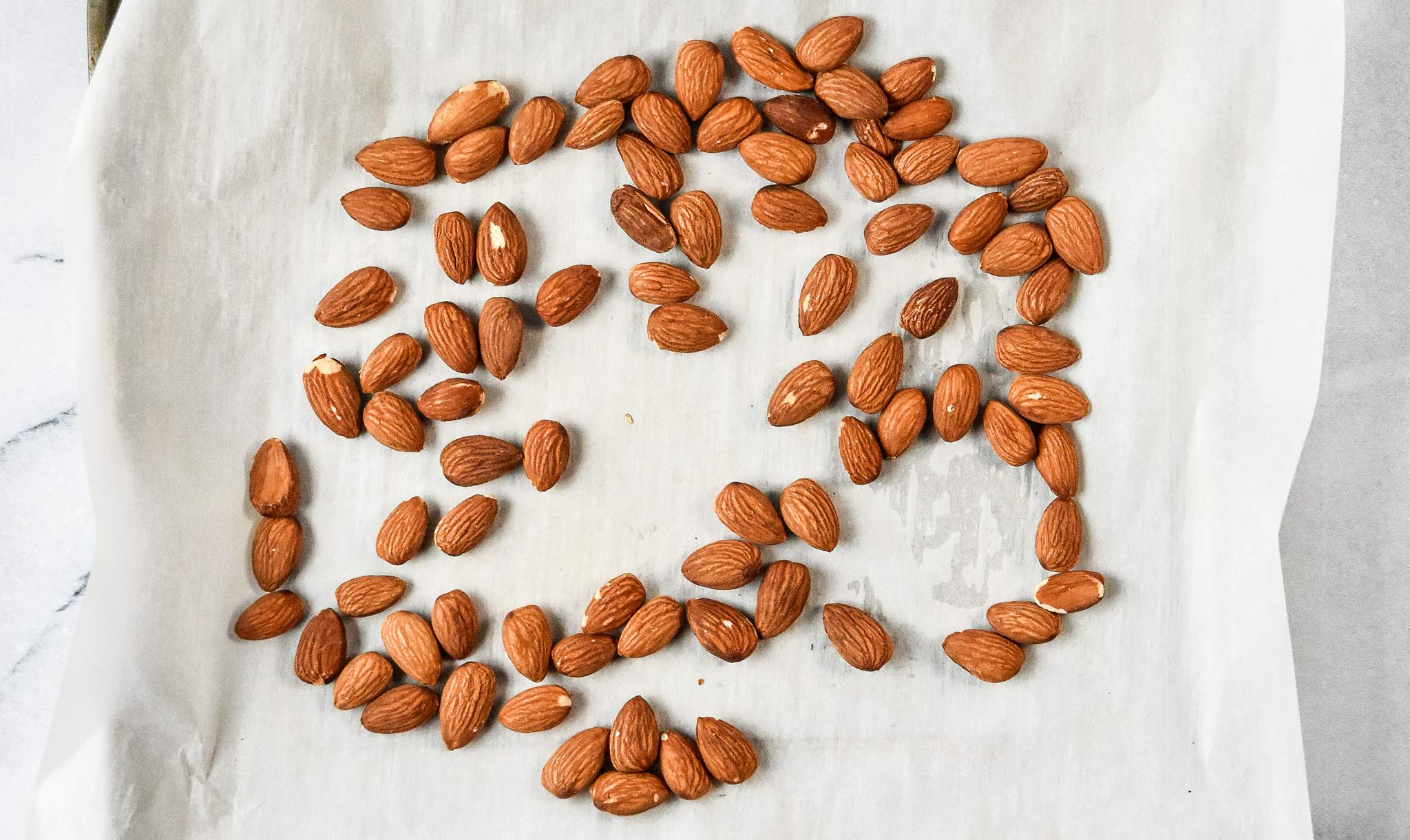 toasted almonds on a sheet tray