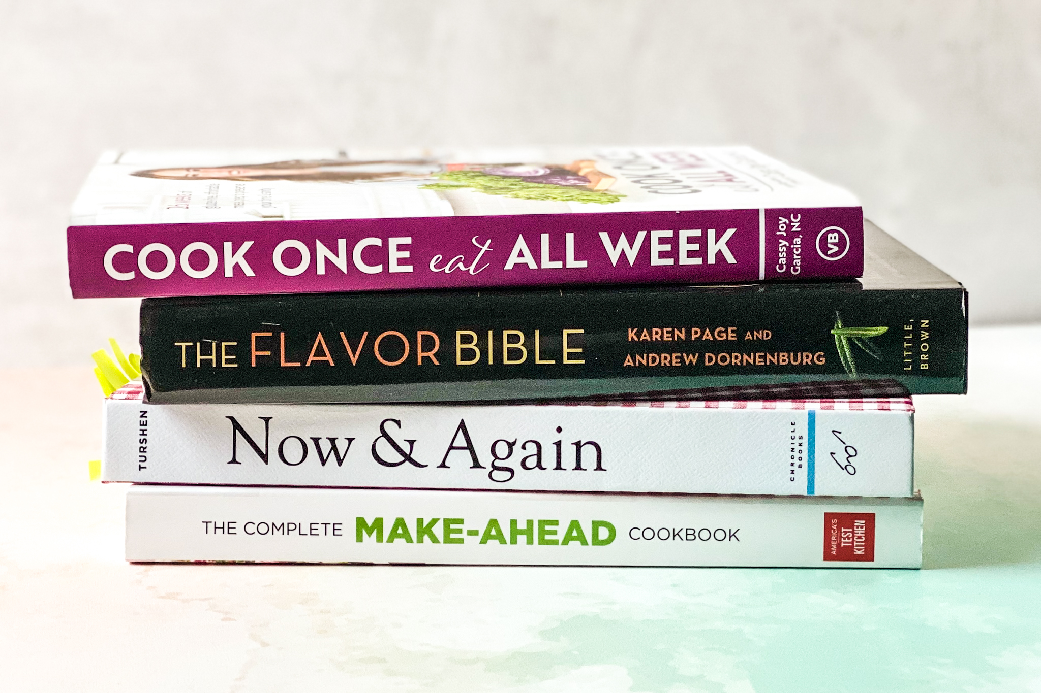 stack of meal prep cookbooks