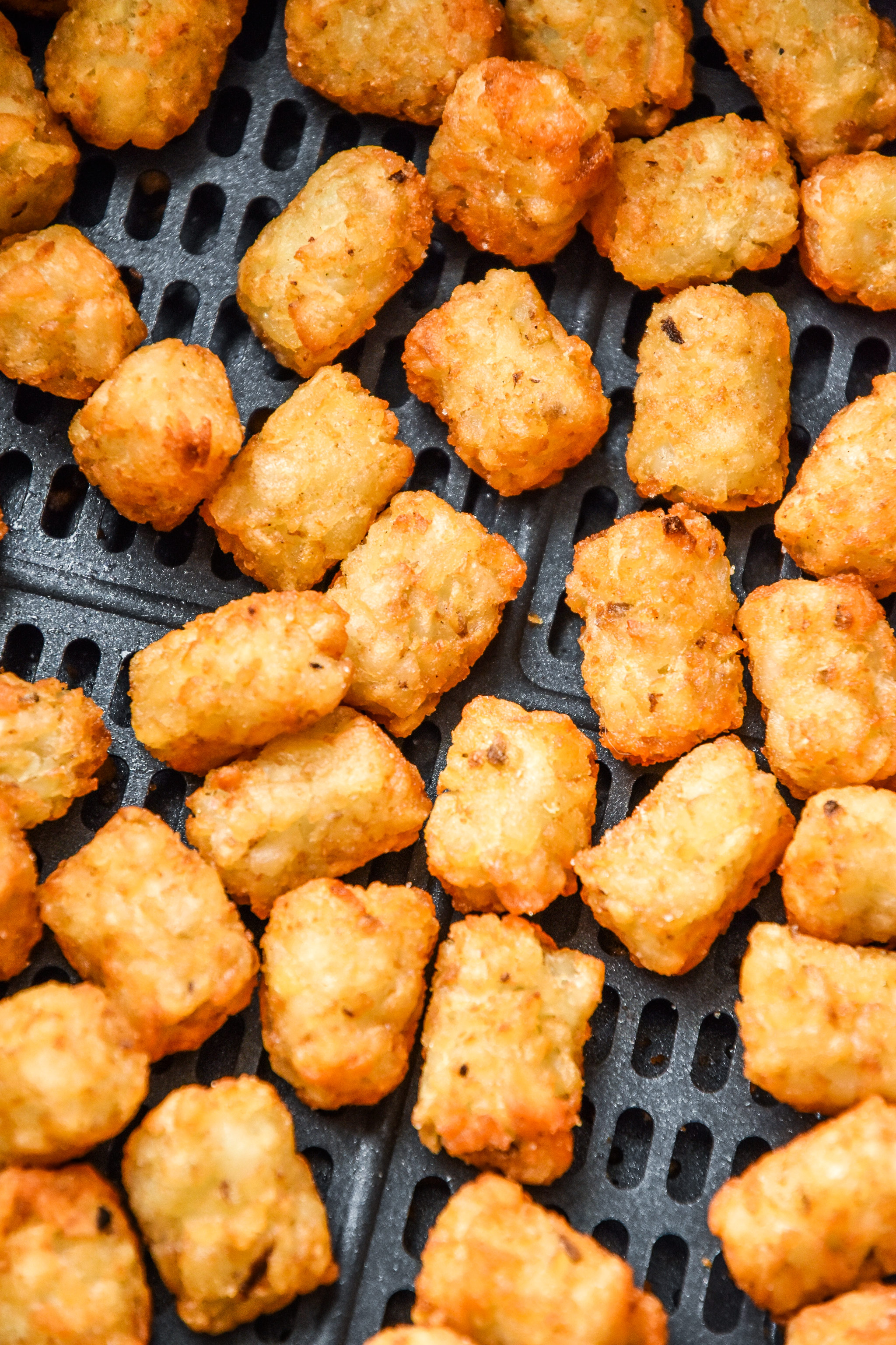 close up of tater tots cooked in an air fryer