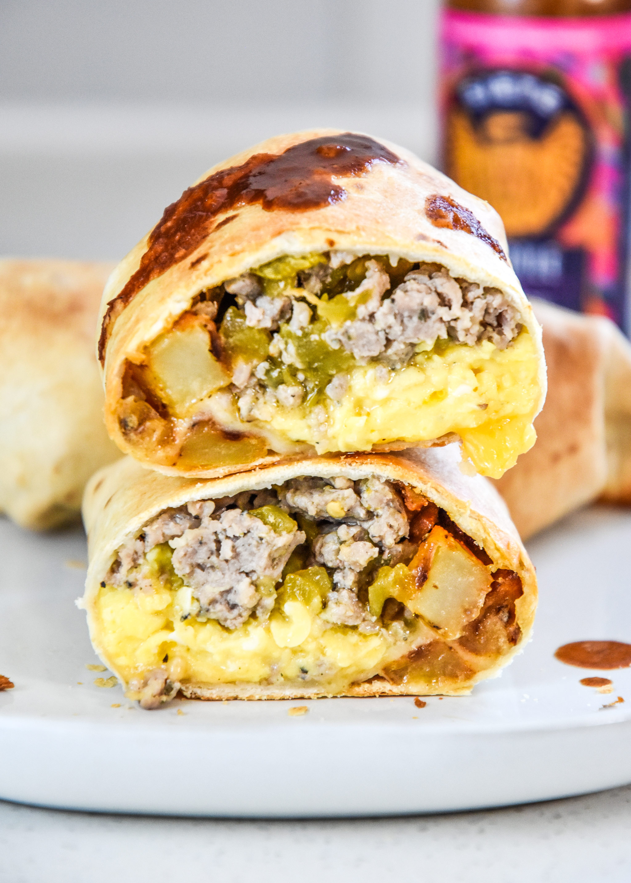 a cooked air fryer breakfast burrito cut in half