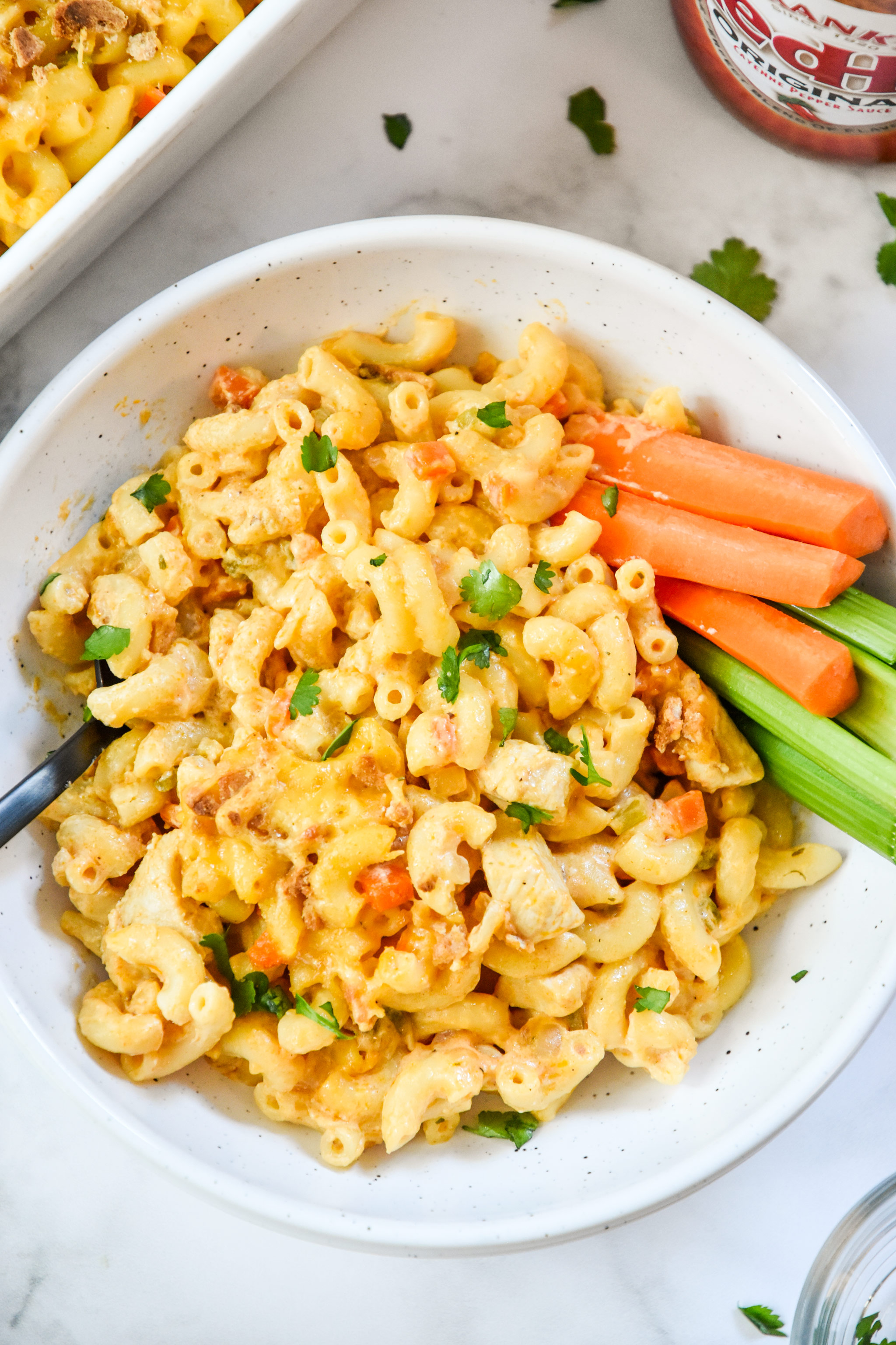 buffalo chicken mac and cheese served with carrots and celery