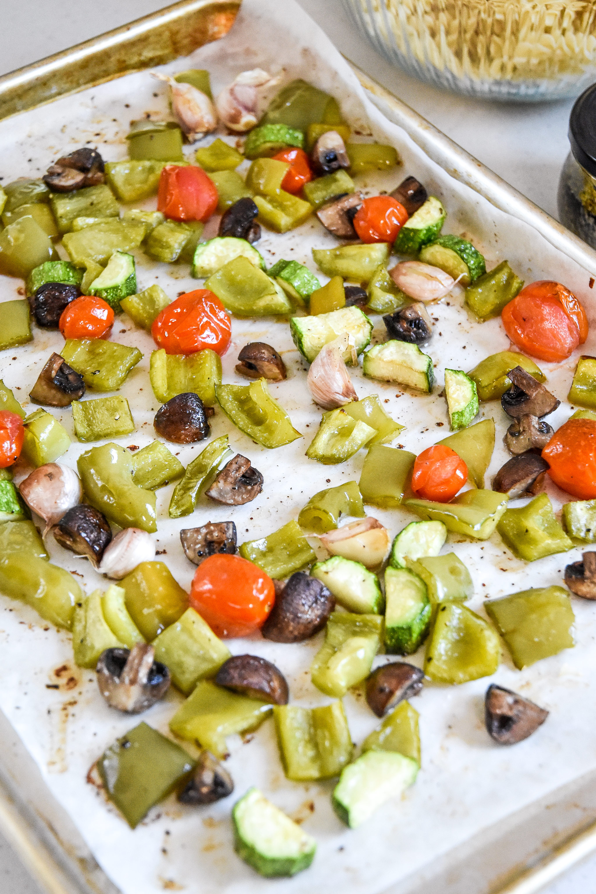 roasted veggies on a sheet pan for the pesto pasta salad