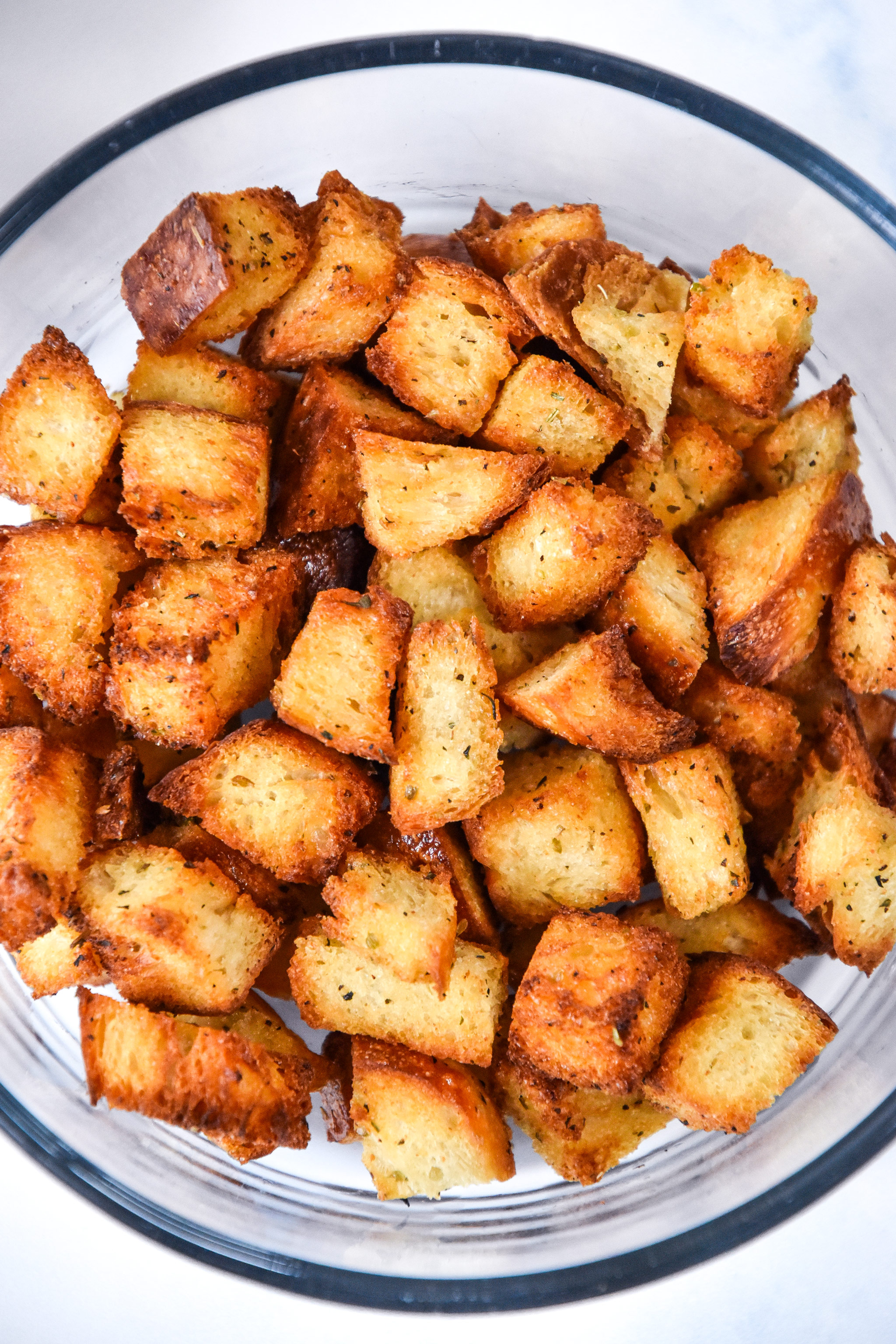 homemade croutons in a bowl for storing.