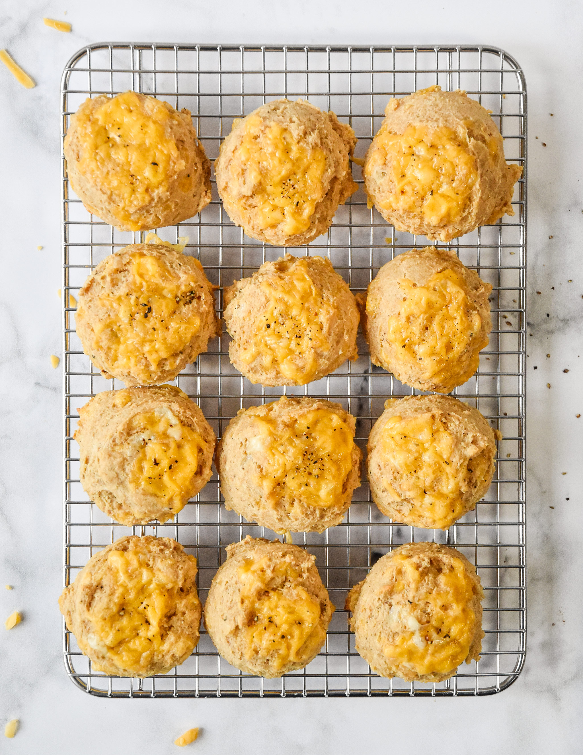 cheddar drop biscuits on a cooling rack.
