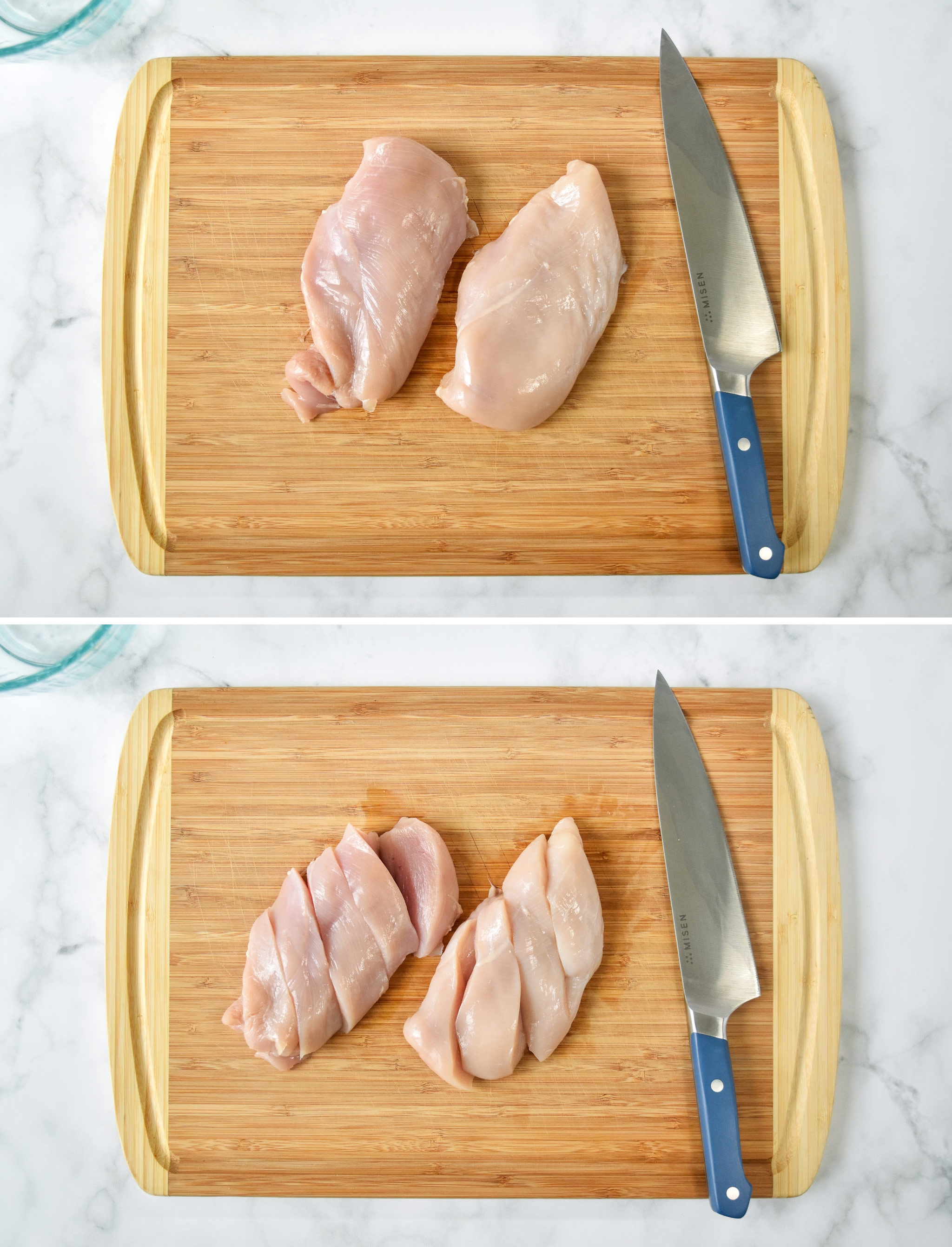 cutting two chicken breasts into strips on a cutting board.