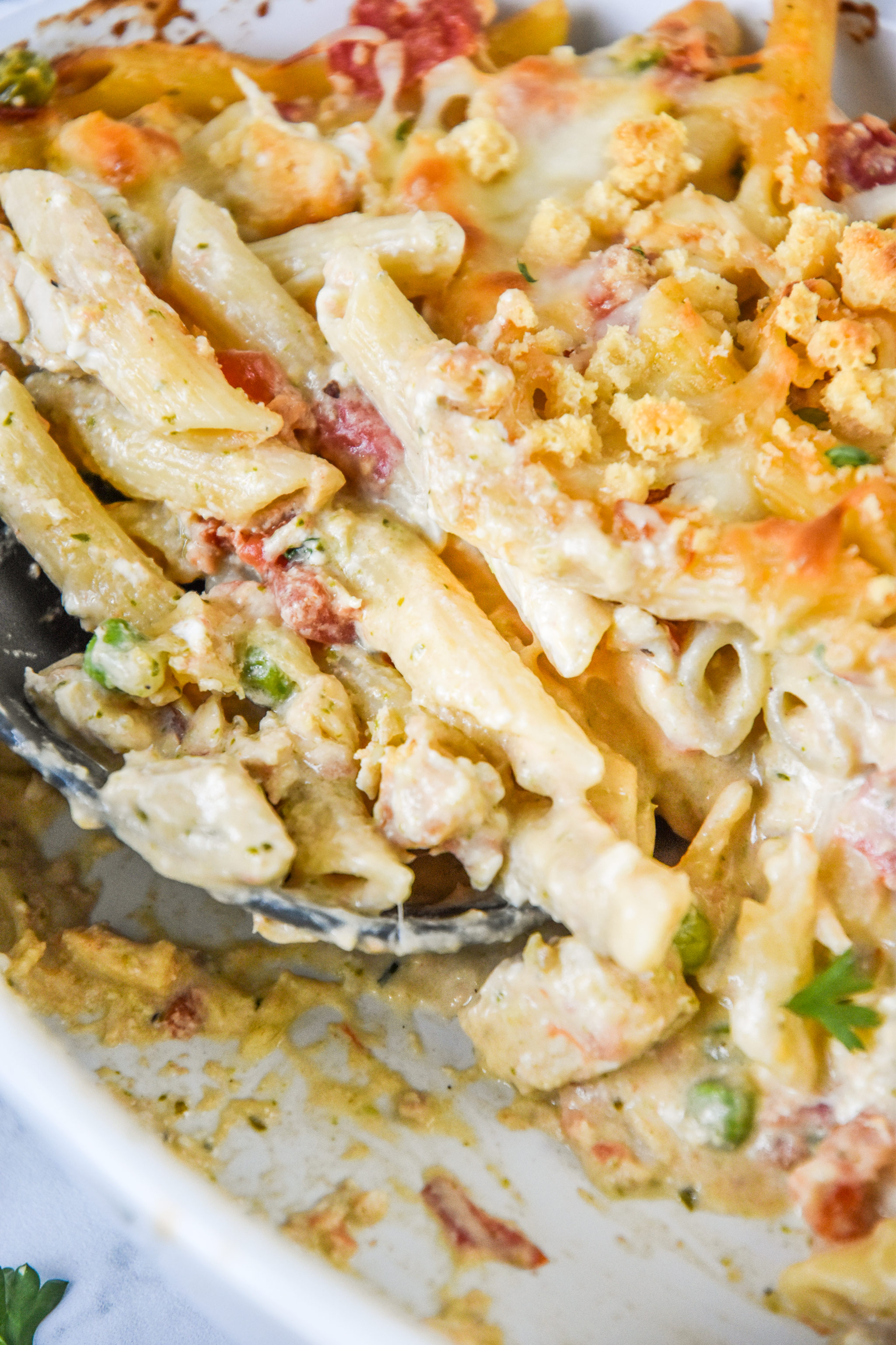 the main dish of creamy pesto pasta chicken bake after cooking.