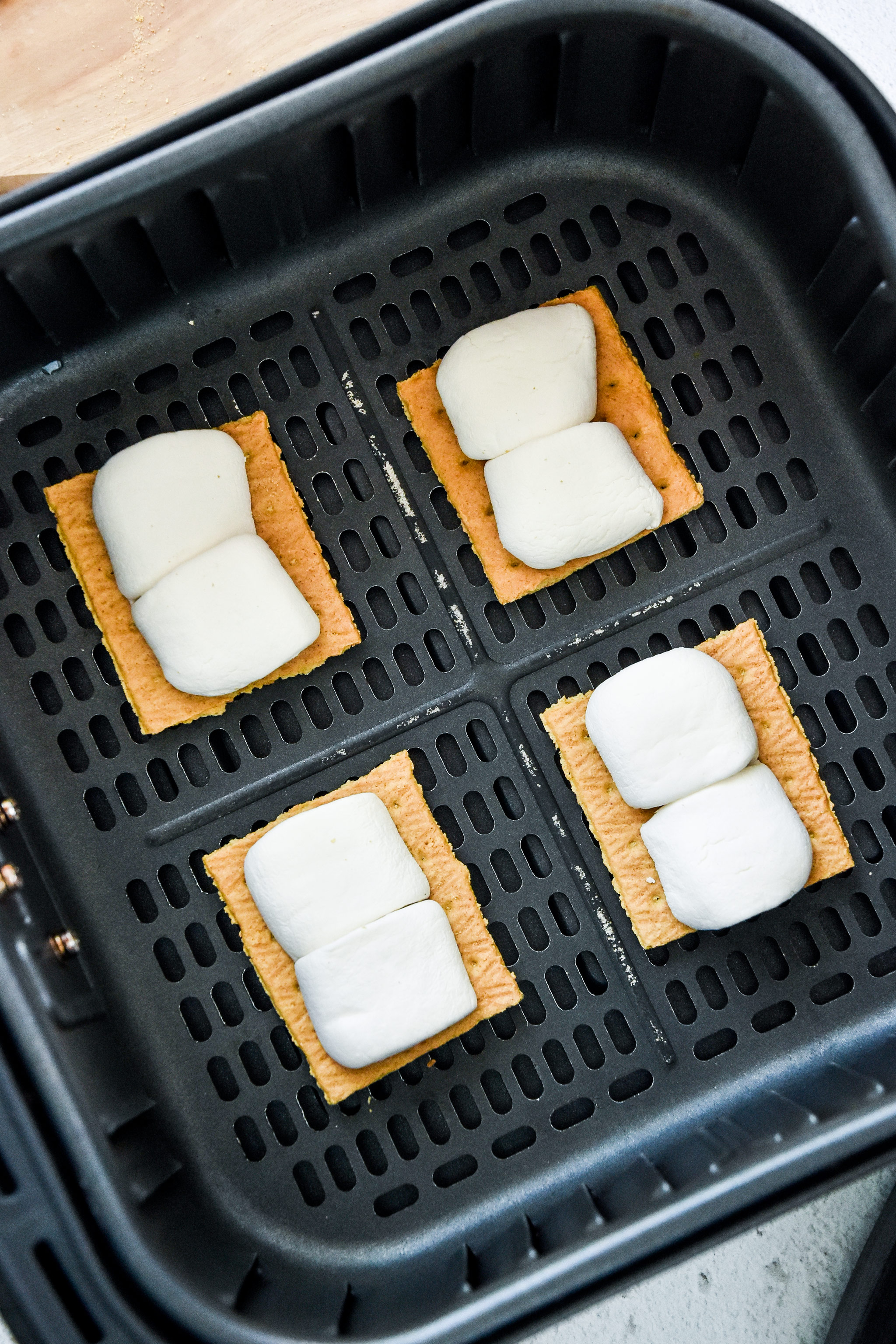 graham crackers with marshmallows in the air fryer basket.