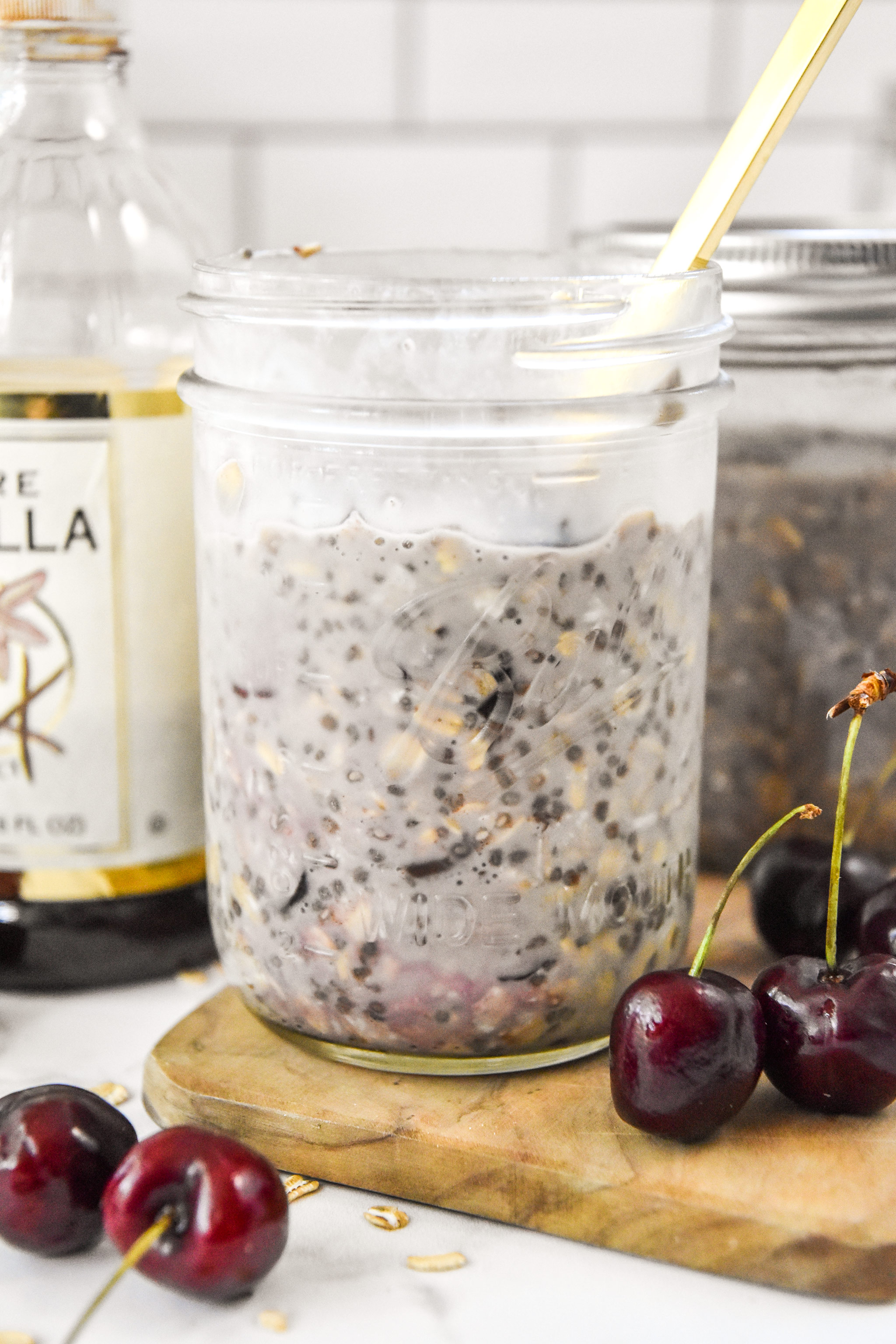 cherry vanilla overnight oats in a mason jar.