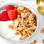 easy peanut butter granola with raspberries and yogurt.