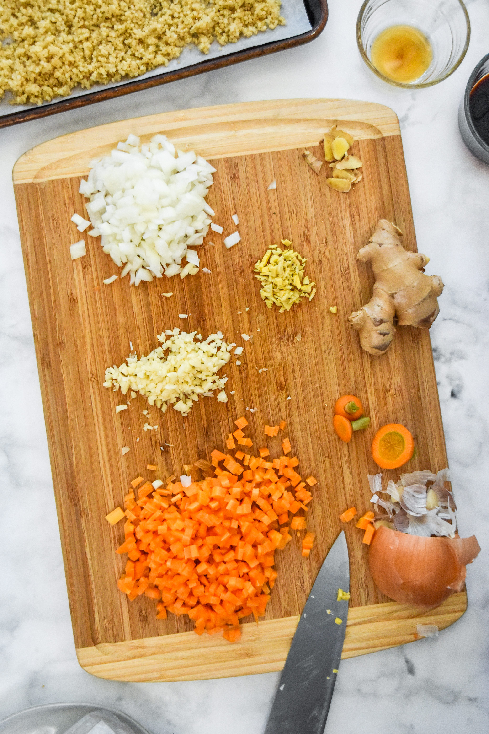 chopped and diced veggie ingredients on a cutting board.