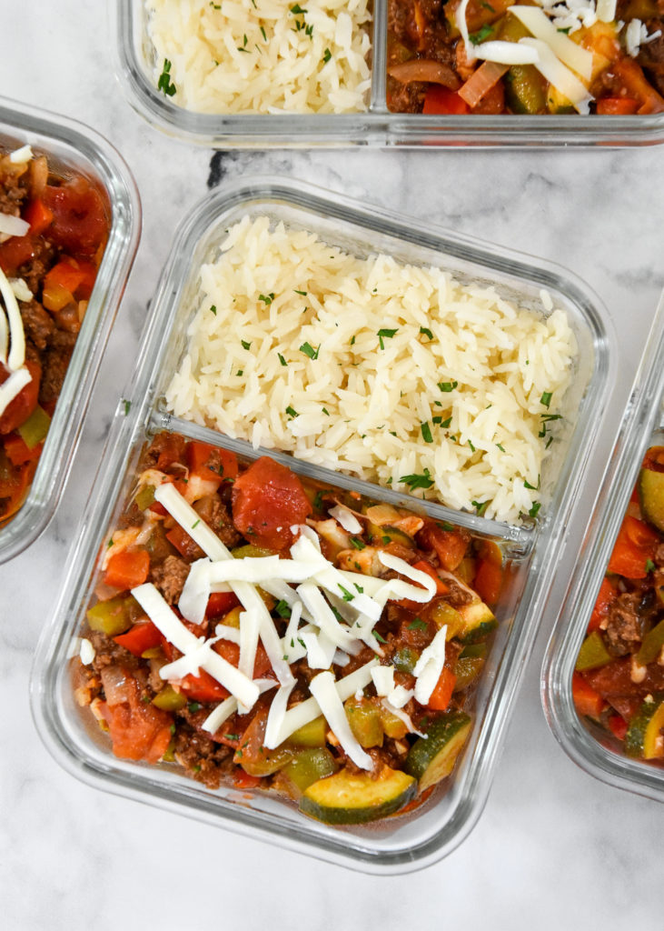 meal prep unstuffed pepper bowls with cheese on top in a glass container.