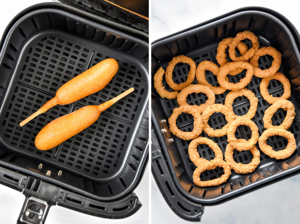frozen foods in the air fryer basket including corn dogs and onion rings.