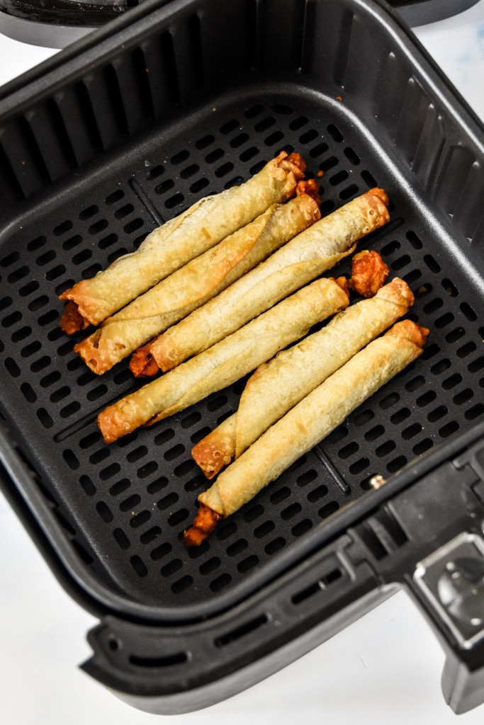 cooked freezer section taquitos in an air fryer.