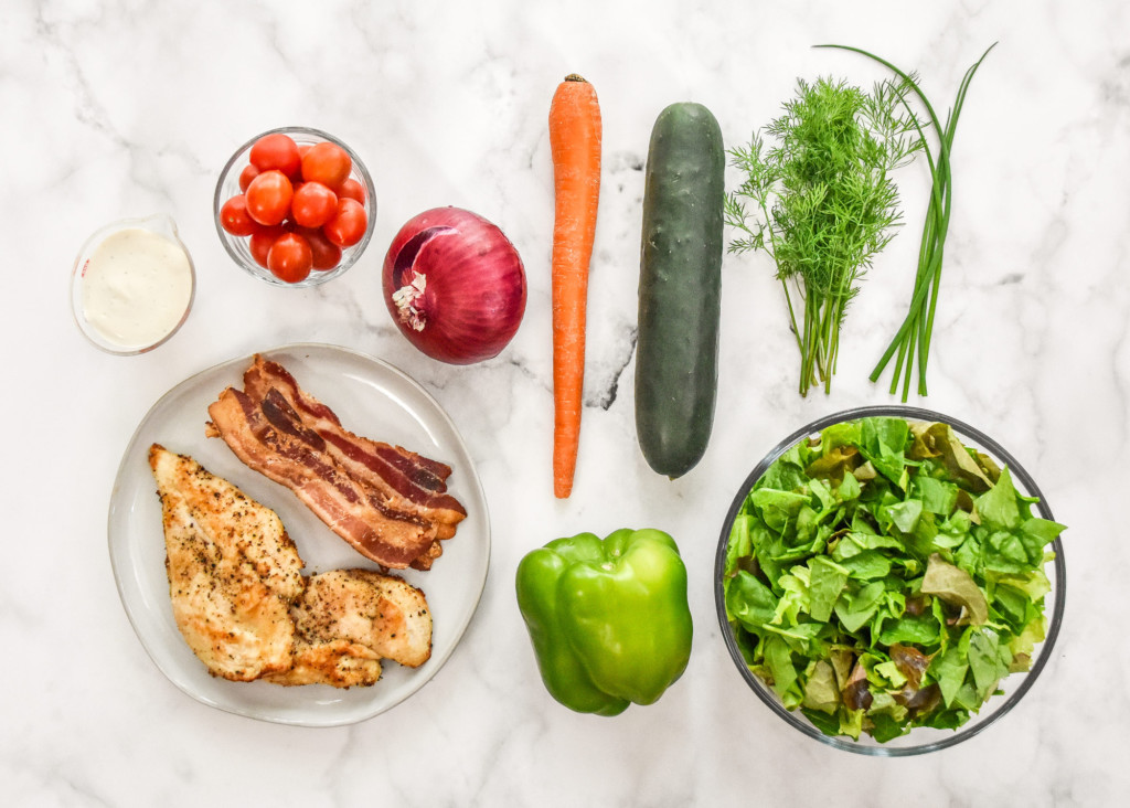 ingredients in a flat lay for the go-to chicken bacon ranch salad.