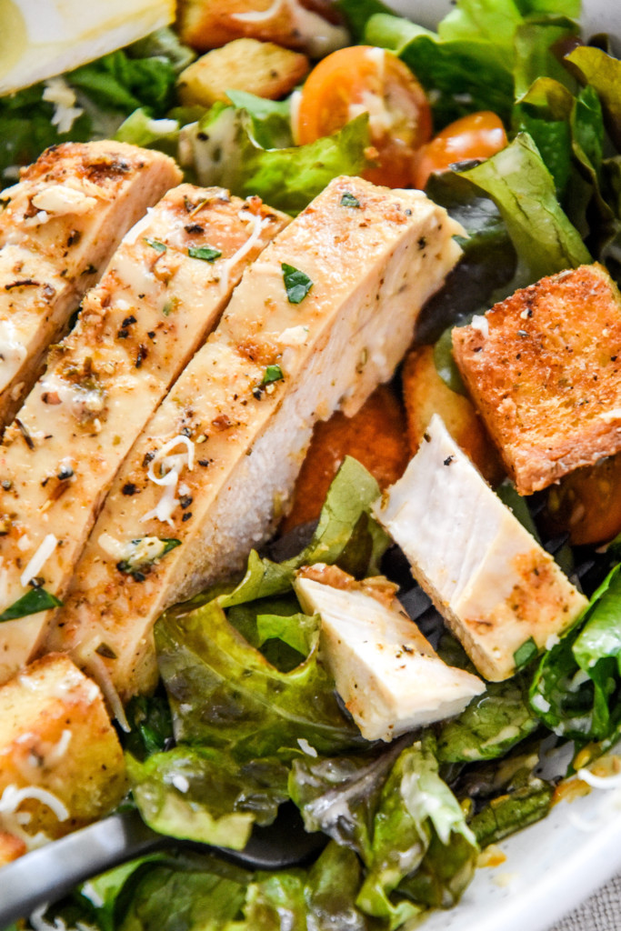 cut chicken breast on the salad.
