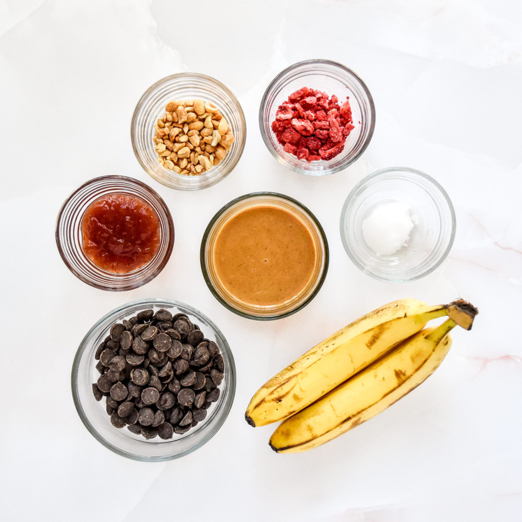ingredients on a counter needed to make chocolate covered PB&J banana bites.