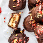 chocolate covered PB&J banana bites on parchment paper.