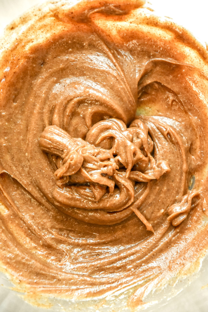 close up of the almond butter and maple syrup mixed together in a bowl.
