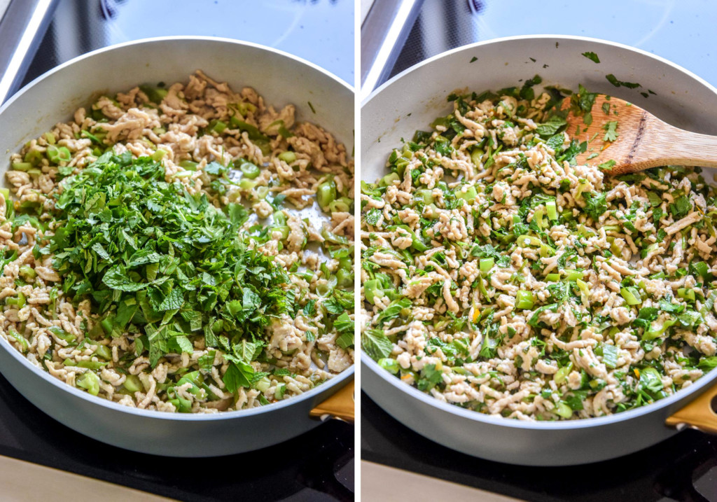 adding the fresh herbs to the pan of chicken larb.