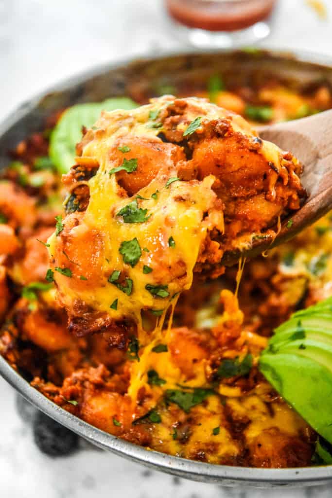a spoonful of soy chorizo gnocchi skillet with cheese.
