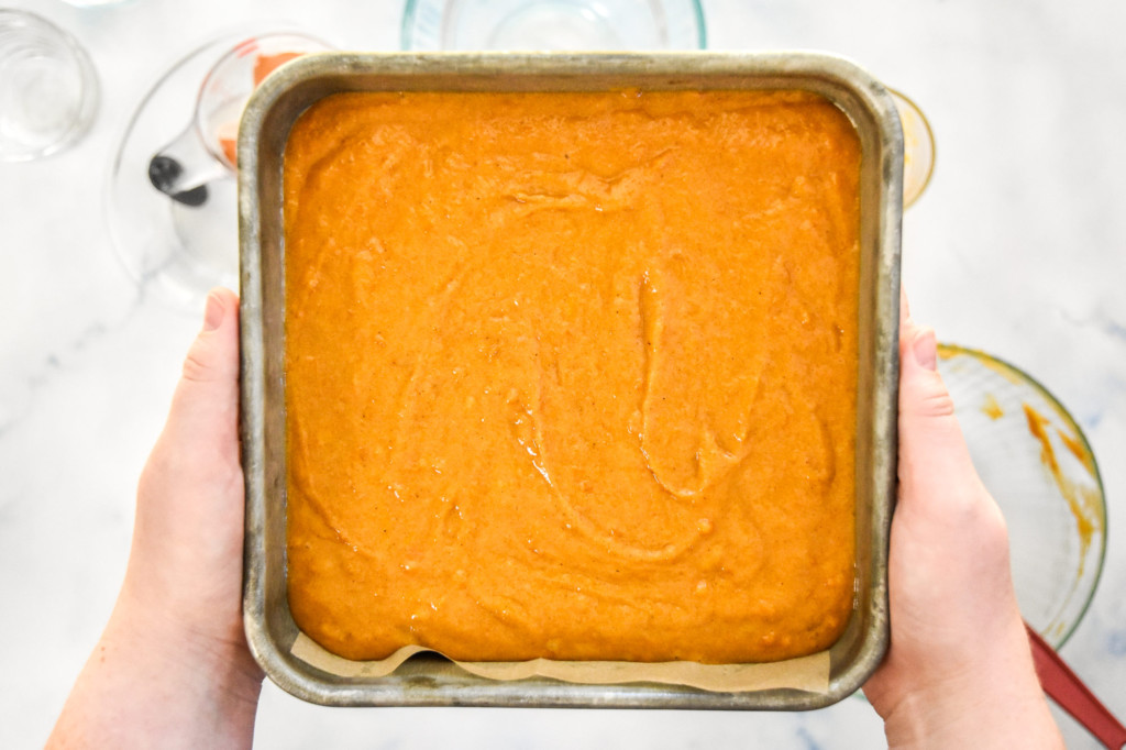 batter for the sweet potato spice cake in the prepared tin before baking.