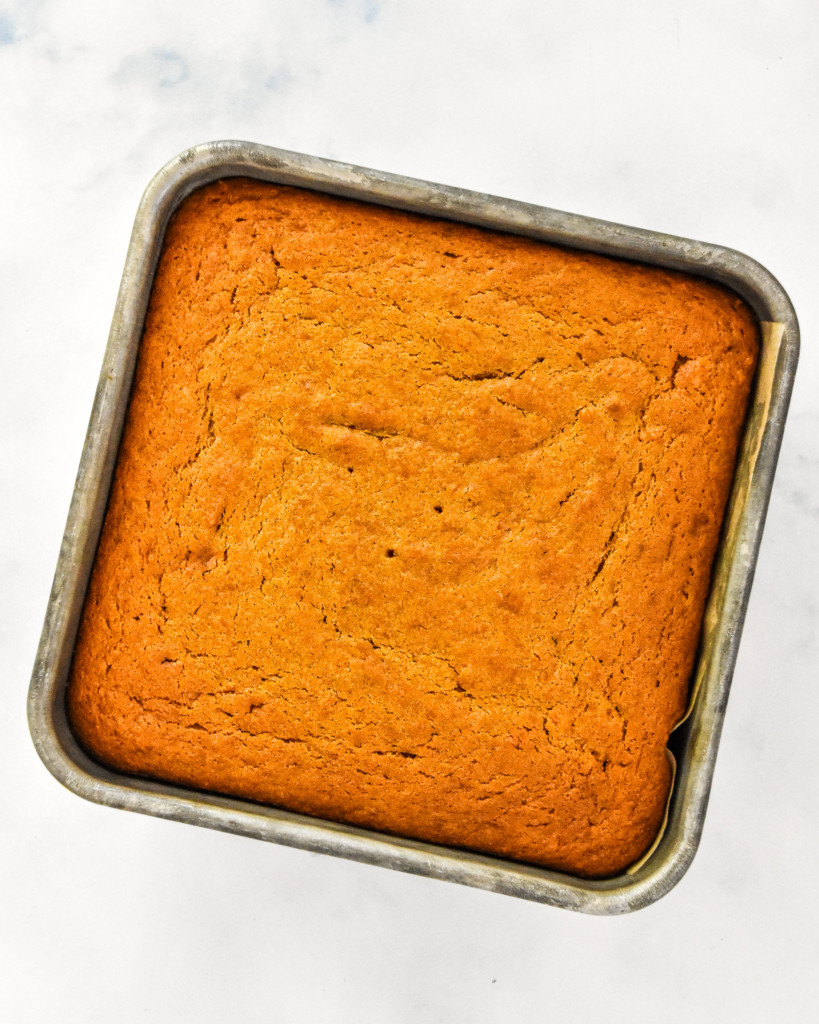 just baked sweet potato spice cake in a metal tin.