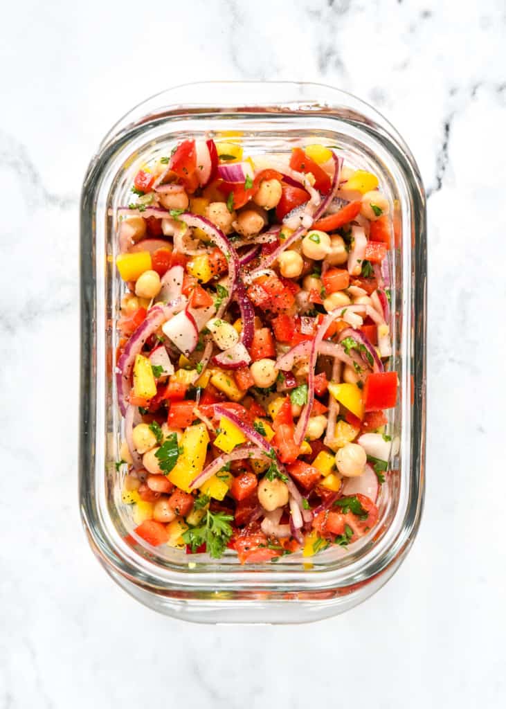make-ahead vegan chickpea salad in a rectangular glass meal prep bowl.