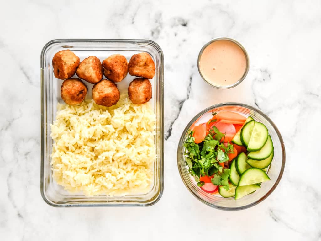 how to meal prep this meal in different containers for reheating: rice and meatballs in one container, veggies in another, sauce in a small container.