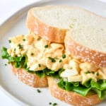 Easy Deviled Egg Salad on white bread with lettuce.