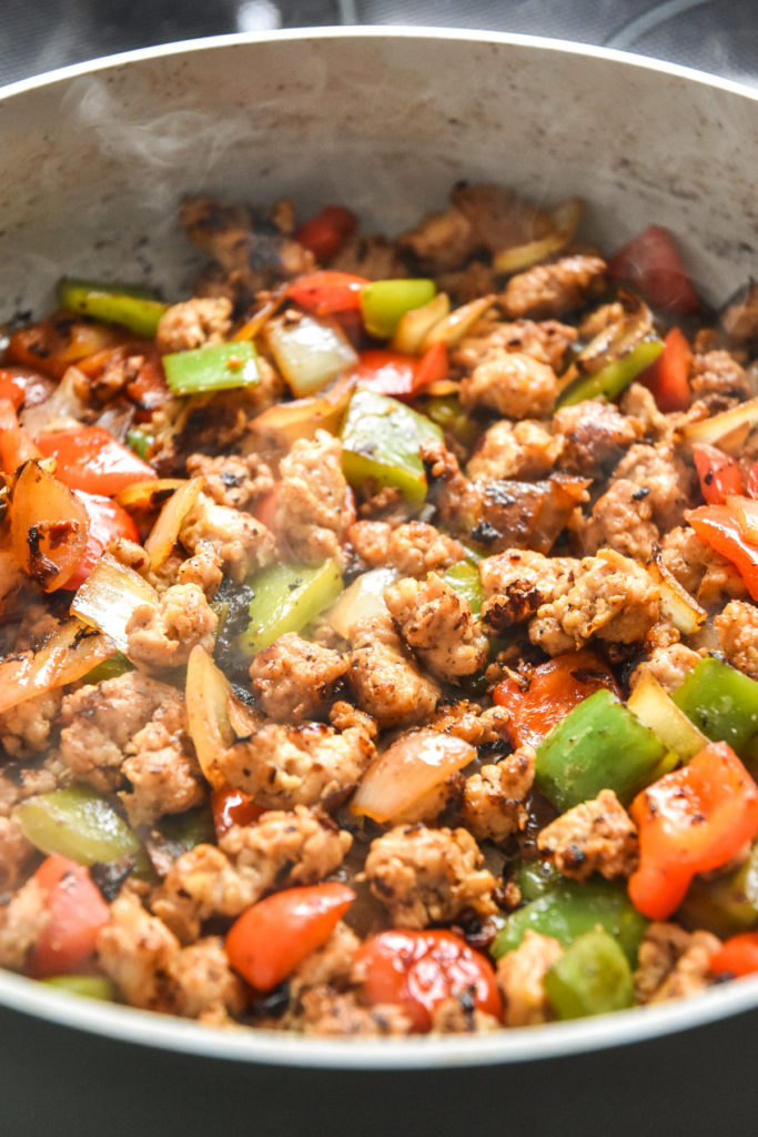 cooked veggie sausage mixture in a skillet for the breakfast bowls.