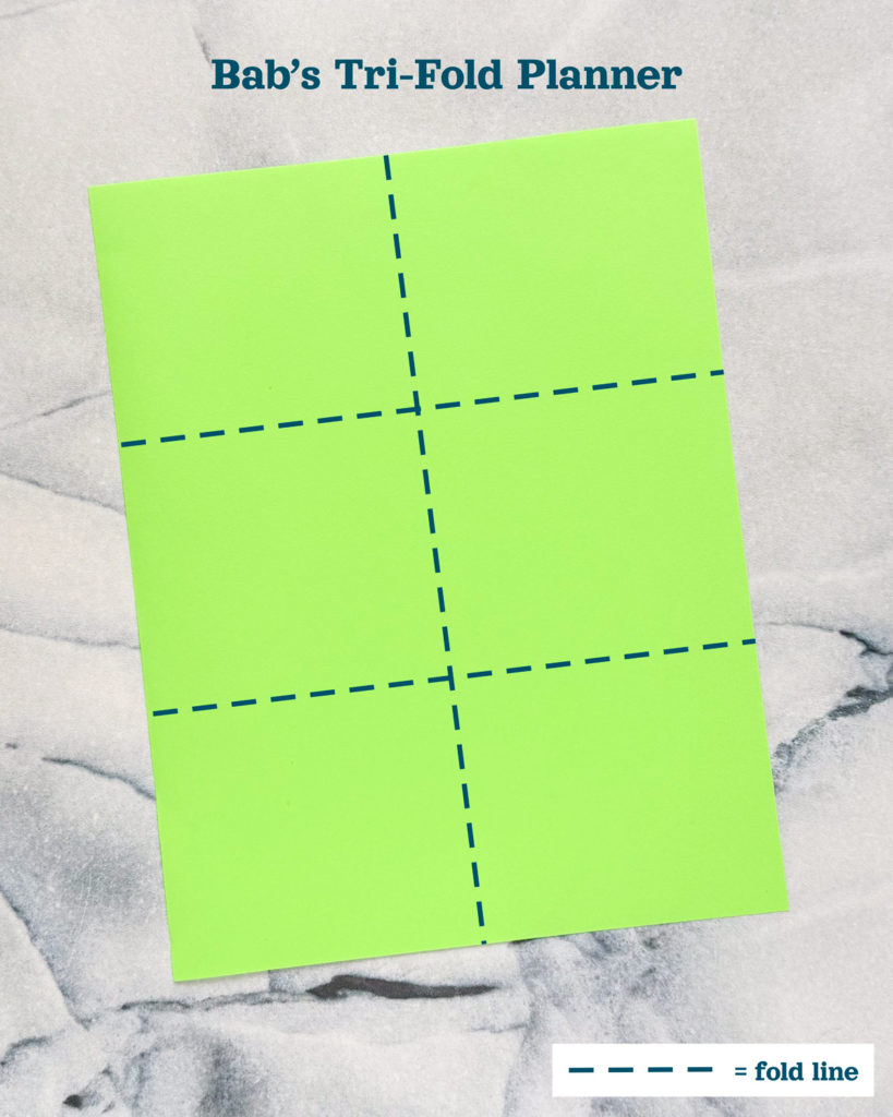 a green piece of paper with fold lines added digitally.