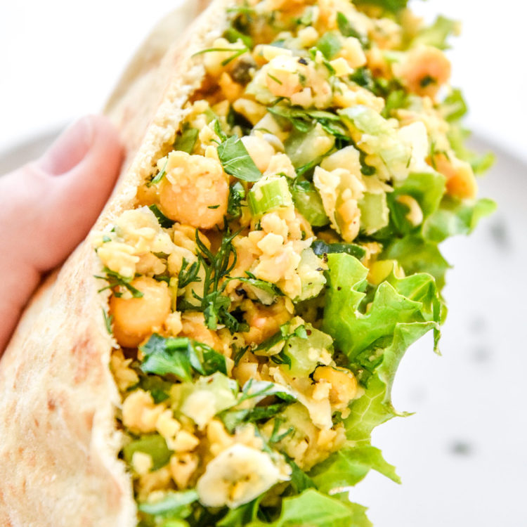 herby lemon mashed chickpea salad in a pita with lettuce.