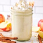 cozy apple pie smoothie with whipped cream on top.