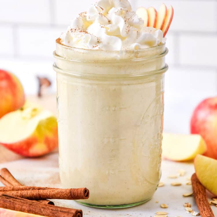 cozy apple pie smoothie with whipped cream on top.