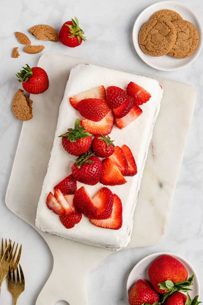 strawberry gingersnap icebox cake with fresh strawberries on top.