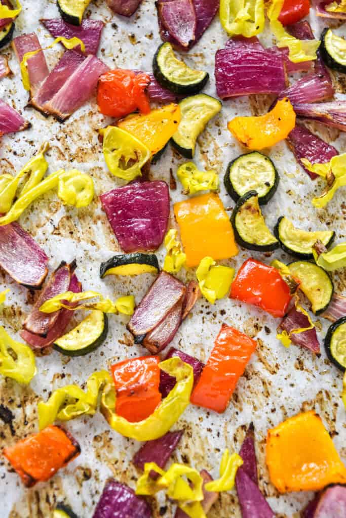 roasted summer vegetables on a sheet pan.